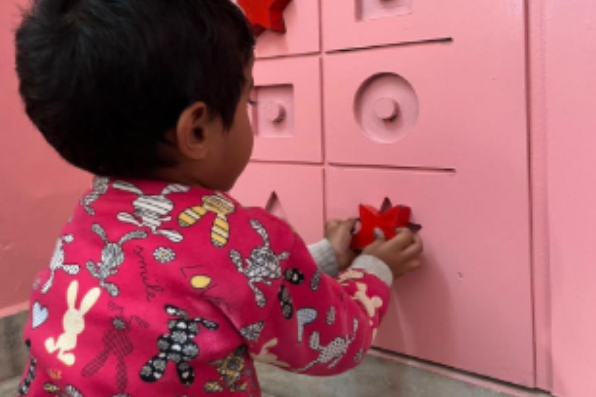 Learning Through Play at SEWA Delhi Community Childcare Child participating in a learning activity at a SEWA Delhi community childcare centre