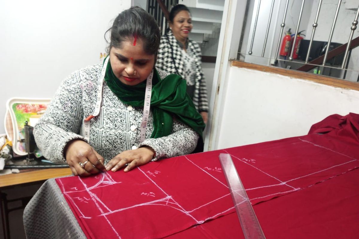 SEWA Delhi woman learning garment cutting and pattern making during skills training