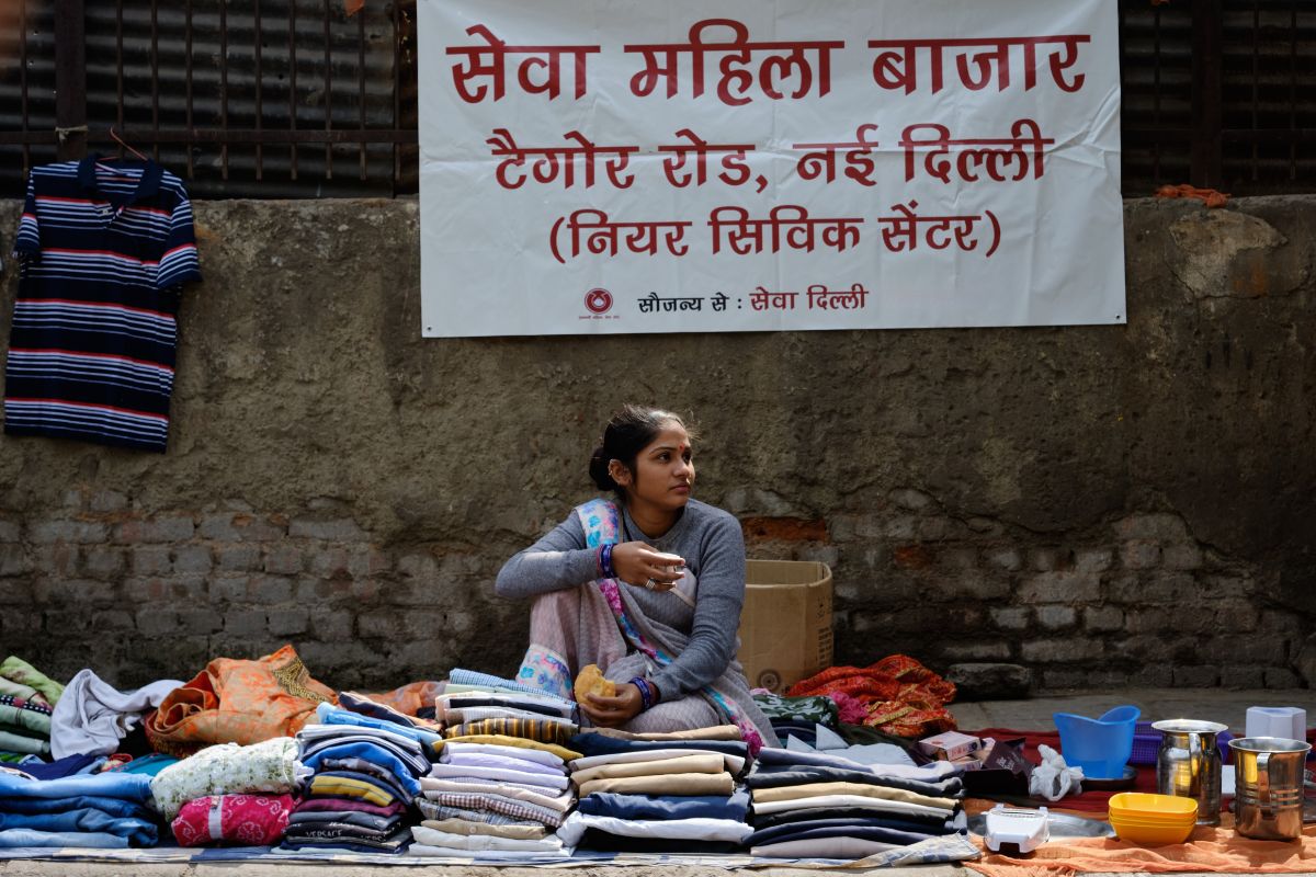 SEWA Delhi woman street vendor selling clothes at SEWA Mahila Bazaar in New Delhi